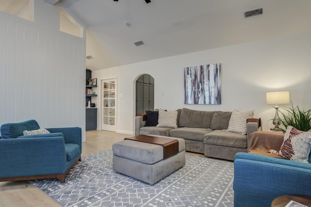 living room with lofted ceiling and hardwood / wood-style floors