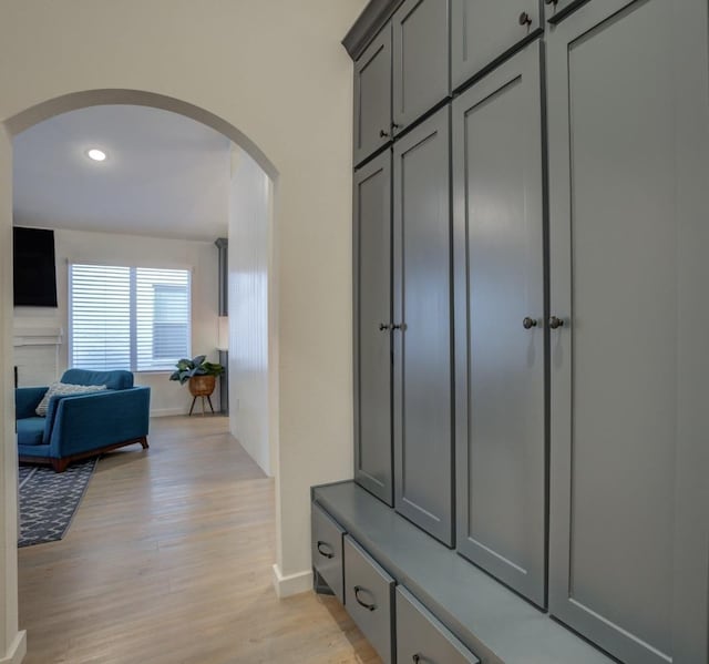 mudroom with light hardwood / wood-style floors