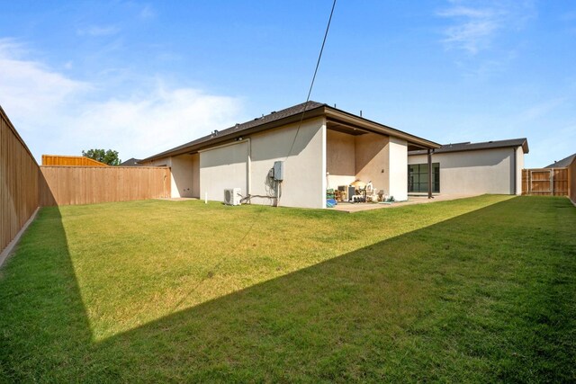 4803 120th St, Lubbock, TX 79424 - back of property featuring stucco siding, a cooling unit, and a patio area