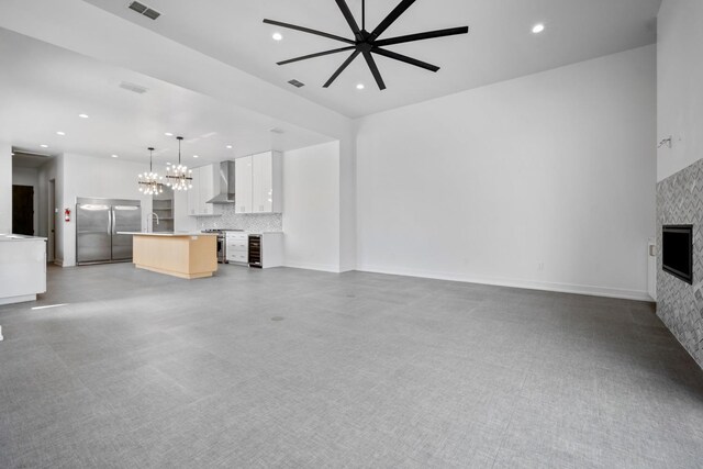 4803 120th St, Lubbock, TX 79424 - unfurnished living room with a fireplace, recessed lighting, a chandelier, ceiling fan, and baseboards