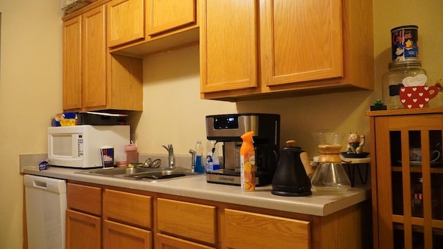 kitchen with sink and white appliances