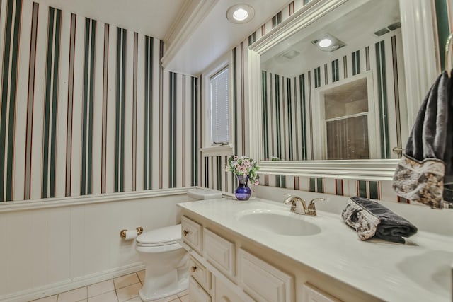 bathroom featuring tile patterned flooring, vanity, and toilet