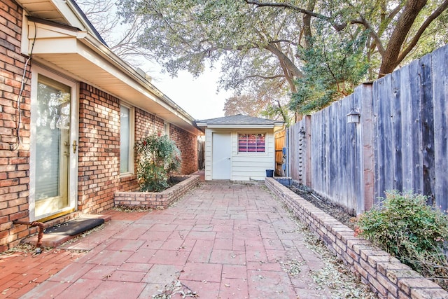 view of patio / terrace with an outbuilding