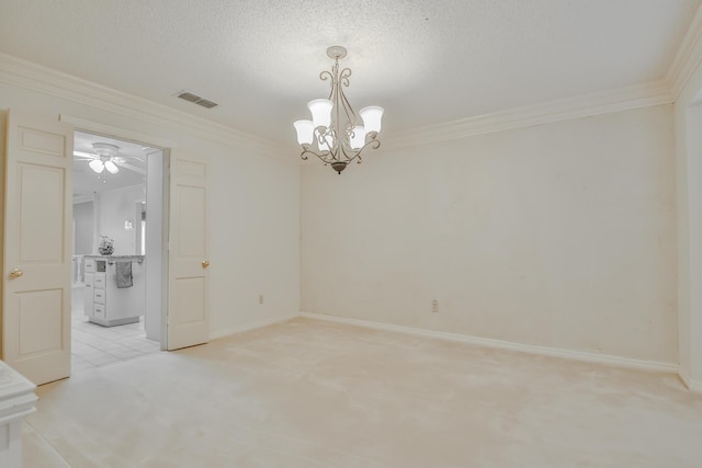 empty room with crown molding, a notable chandelier, and a textured ceiling