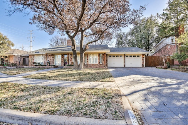 ranch-style house featuring a garage