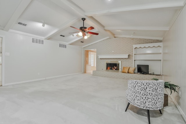 carpeted living room with lofted ceiling with beams, a brick fireplace, and ceiling fan