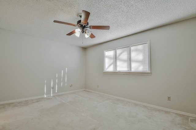 unfurnished room featuring ceiling fan and a textured ceiling