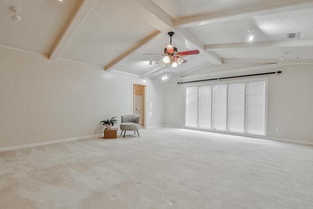 unfurnished room featuring ceiling fan, light carpet, and vaulted ceiling with beams