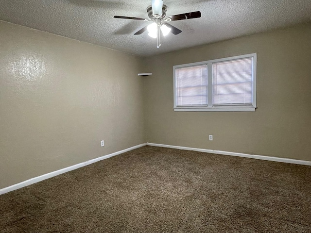 empty room featuring ceiling fan, carpet floors, and a textured ceiling