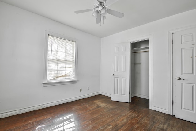 unfurnished bedroom featuring dark wood-type flooring, ceiling fan, and a closet