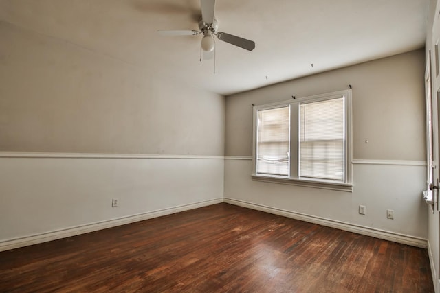 unfurnished room with dark wood-type flooring and ceiling fan