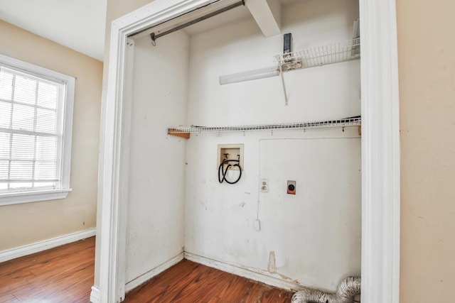 washroom featuring electric dryer hookup, washer hookup, and dark wood-type flooring