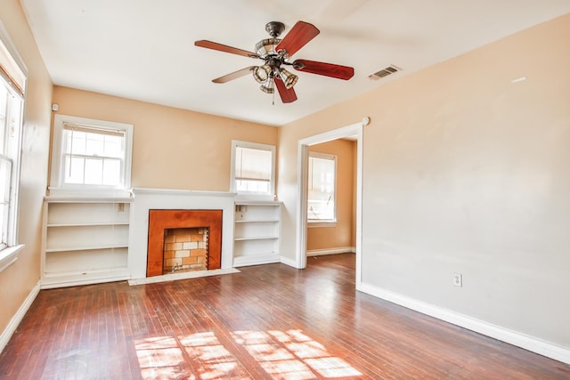 unfurnished living room with dark hardwood / wood-style floors and ceiling fan