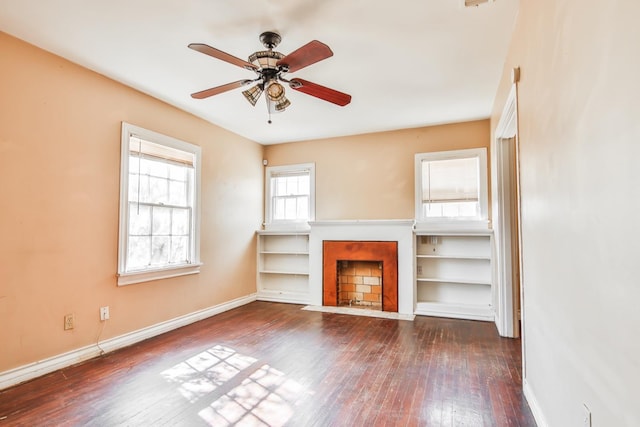 unfurnished living room featuring dark hardwood / wood-style floors and ceiling fan