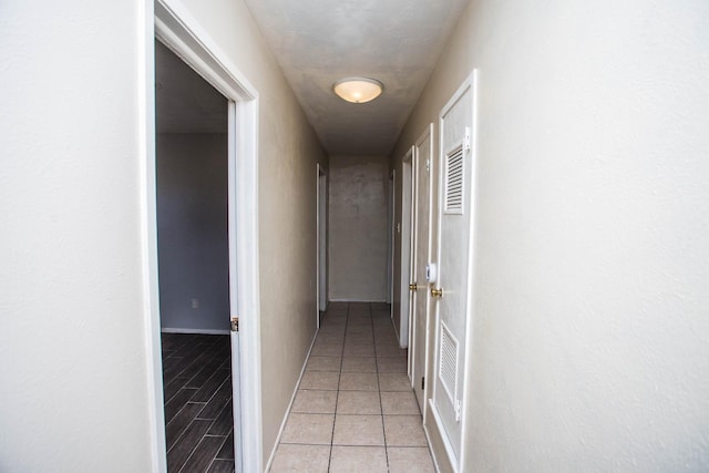 corridor with light tile patterned floors