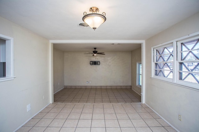 spare room featuring light tile patterned floors