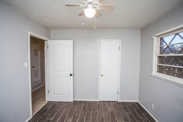 unfurnished bedroom featuring ceiling fan