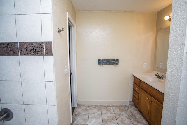 bathroom with vanity and tile patterned flooring