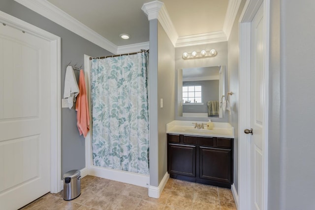 bathroom with walk in shower, vanity, and crown molding