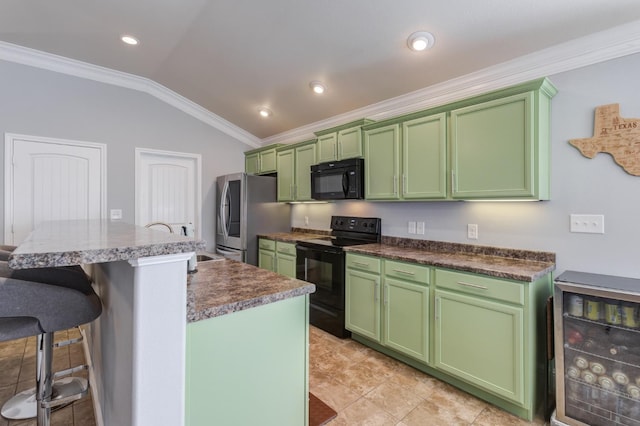 kitchen featuring a center island, ornamental molding, black appliances, green cabinetry, and vaulted ceiling