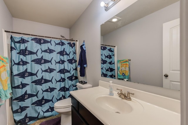 bathroom featuring a shower with curtain, vanity, and toilet