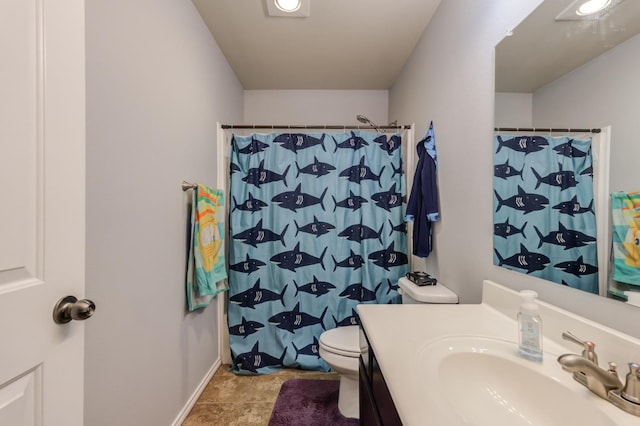 bathroom with vanity, toilet, and a shower with shower curtain