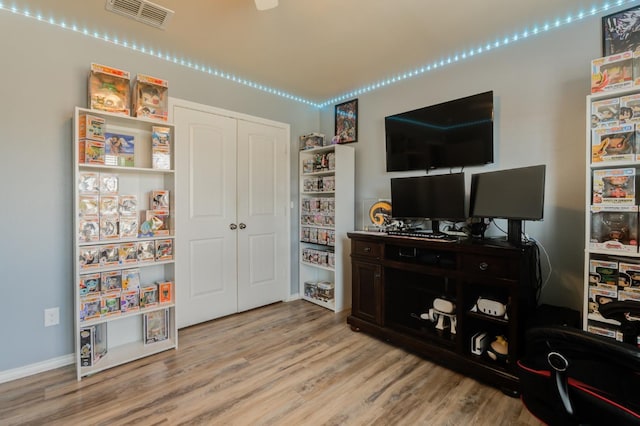 recreation room with light wood-type flooring