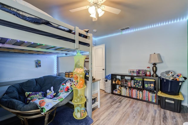 bedroom featuring ceiling fan and hardwood / wood-style floors