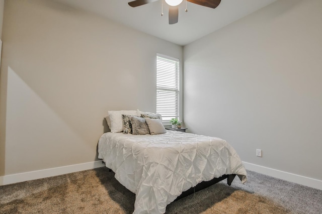 bedroom featuring ceiling fan and carpet