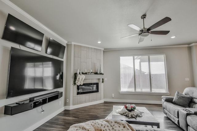 living room featuring crown molding, dark hardwood / wood-style floors, a fireplace, and ceiling fan