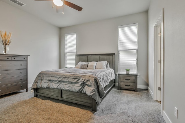 bedroom with light carpet and ceiling fan