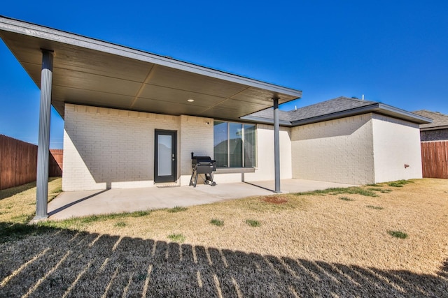 rear view of house featuring a patio