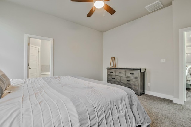 bedroom featuring ceiling fan, ensuite bath, and carpet flooring