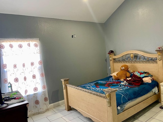 bedroom featuring light tile patterned flooring