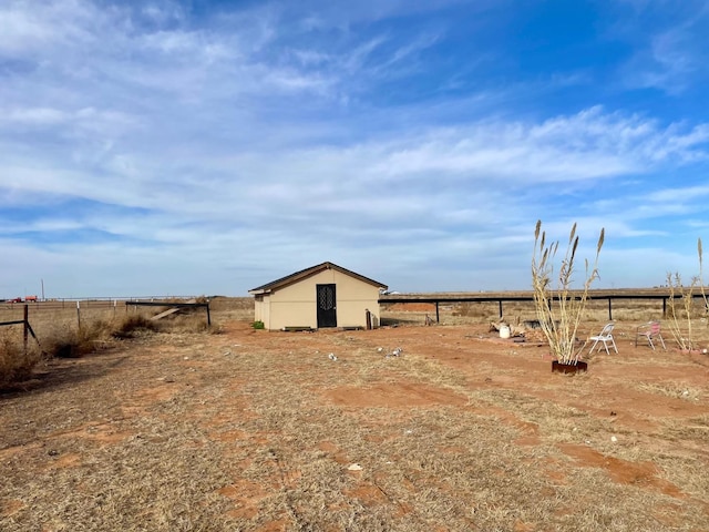 view of yard with a rural view