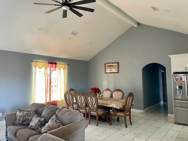 dining space with beamed ceiling, ceiling fan, and high vaulted ceiling