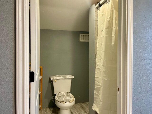 bathroom featuring toilet