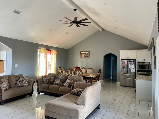 living room featuring ceiling fan and lofted ceiling with beams