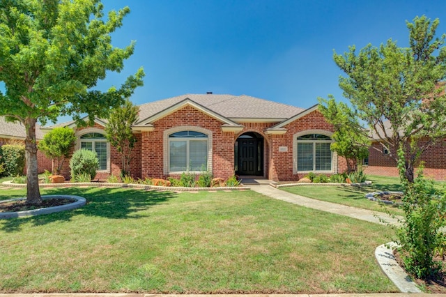 ranch-style house with a front yard