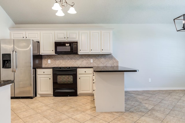 kitchen featuring an inviting chandelier, black appliances, hanging light fixtures, light tile patterned floors, and white cabinets