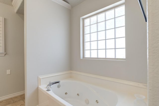 bathroom featuring crown molding, a wealth of natural light, and a tub to relax in