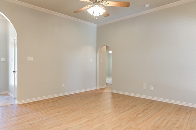 spare room with ceiling fan, ornamental molding, and light hardwood / wood-style flooring