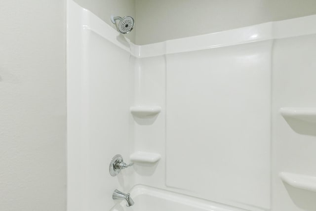 bathroom featuring  shower combination