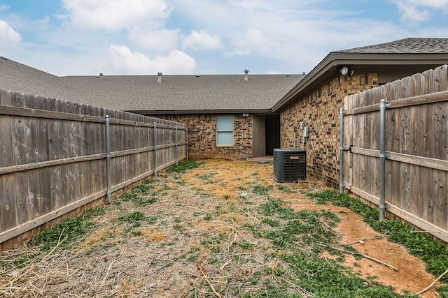 view of yard featuring a fenced backyard and cooling unit