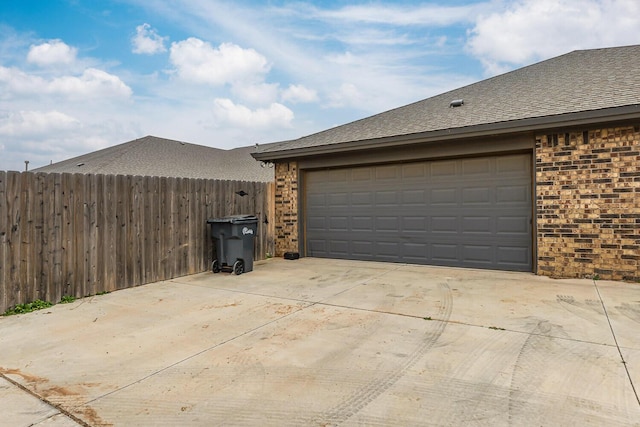 garage featuring fence