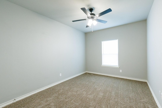 unfurnished room with carpet, ceiling fan, and baseboards