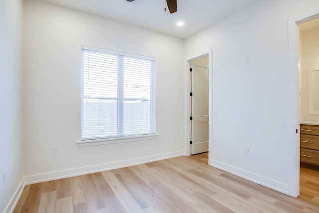 unfurnished room featuring ceiling fan and light hardwood / wood-style floors