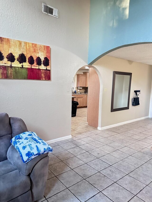 hallway with light tile patterned floors