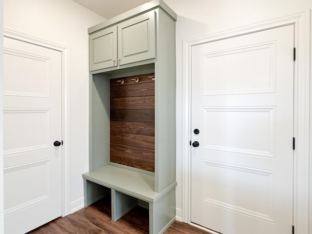 mudroom with dark wood finished floors