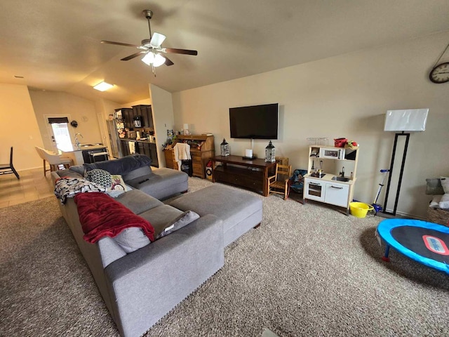 carpeted living room with lofted ceiling and ceiling fan